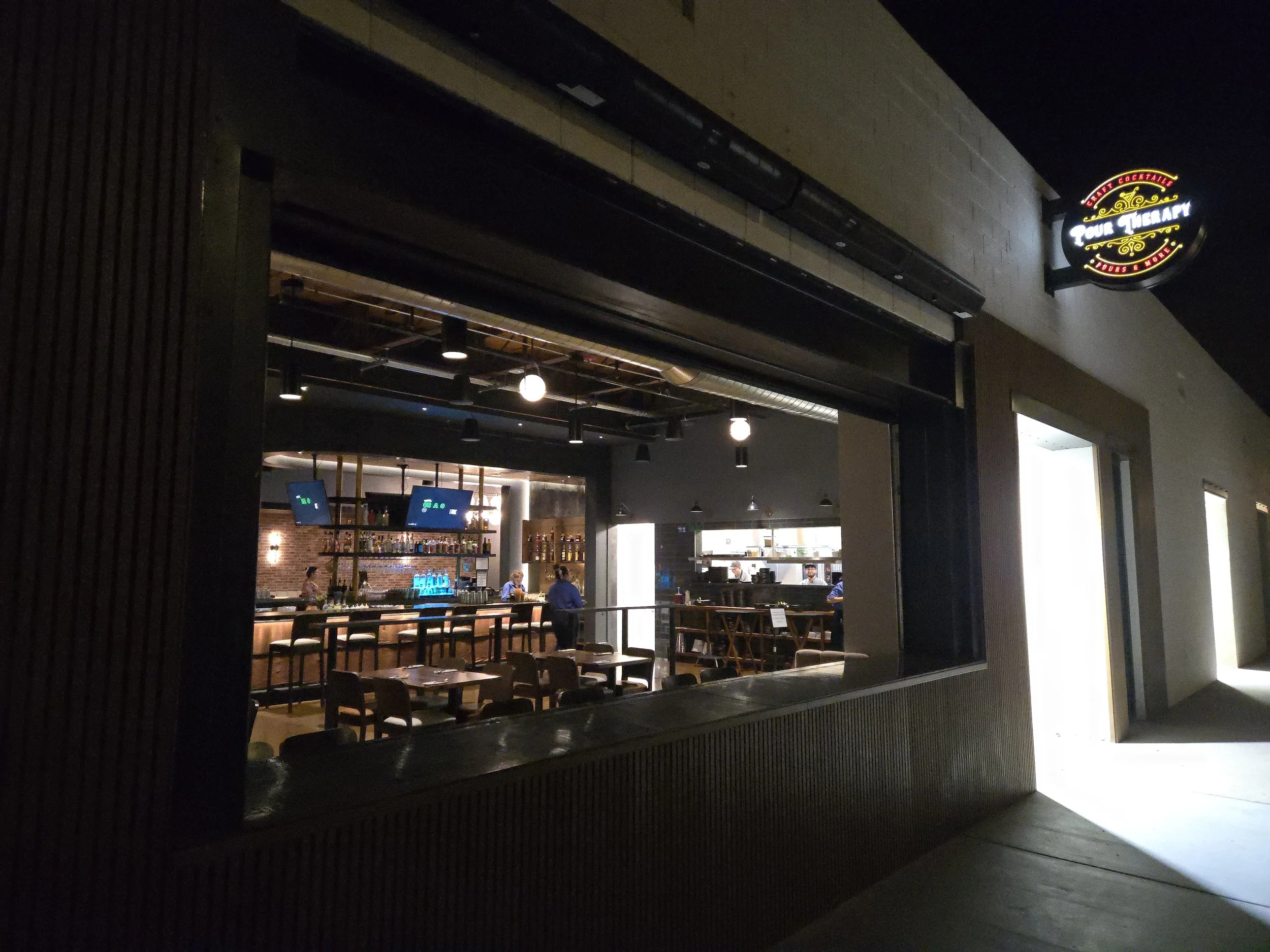 Garage window open on a beautiful night for Pour Therapy