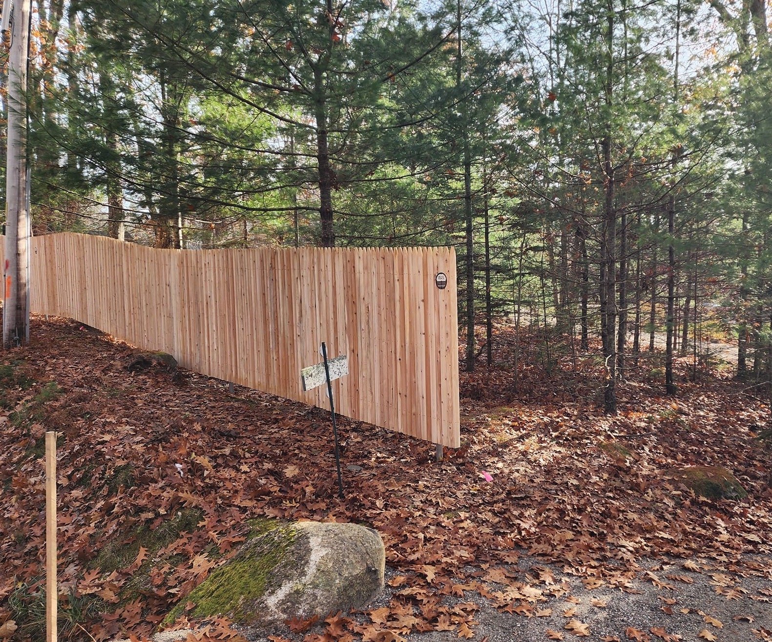 6' tall cedar stockade on exposed steel posts (C29)