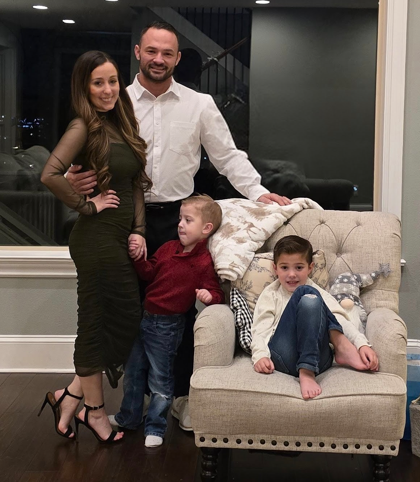 Home is where life happens. Mike and Hayley Maddux with their sons Noah and Michael during the holiday season.