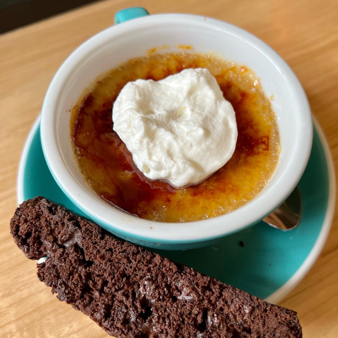 Hello world, meet our Coffee Cr&egrave;me Br&ucirc;l&eacute;e! ☕️ Made with our Durham neighbors Counter Culture Coffee&rsquo;s freshly roasted beans 🤤 And comes with a soft dollop of house-made whipped cream and a double chocolate-toffee biscotti! 