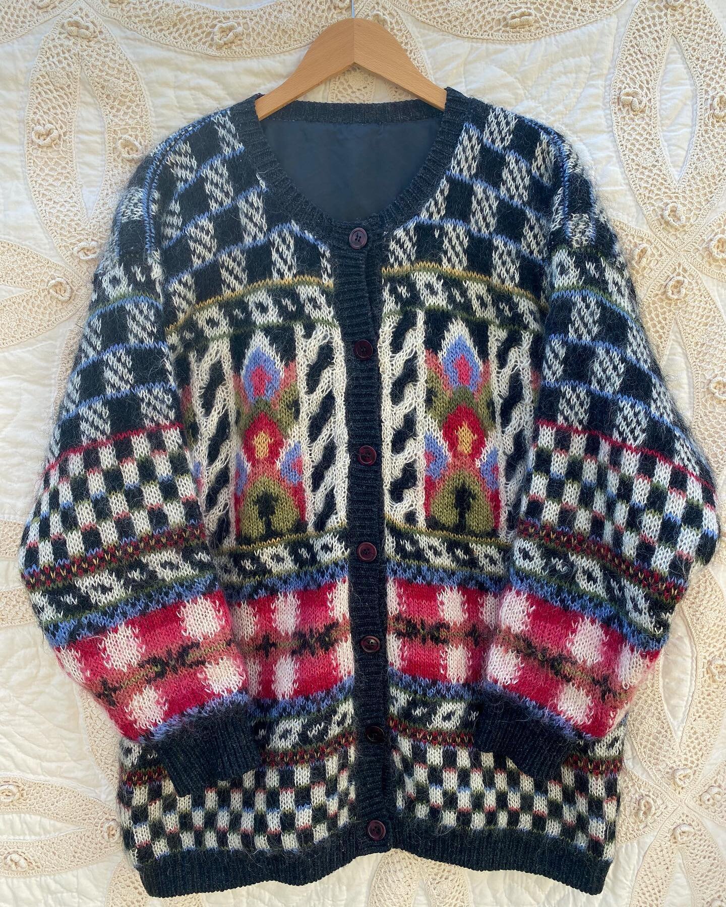 Available! 90&rsquo;s abstract floral motif mohair sweater jacket! A dream 🌷🌸🌼🌻

Details: 
Best fits sizes M - XL depending on desired fit. 
Measures 30&rdquo; in length and 25&rdquo; across chest laying flat.

Mohair / wool / acrylic blend fully