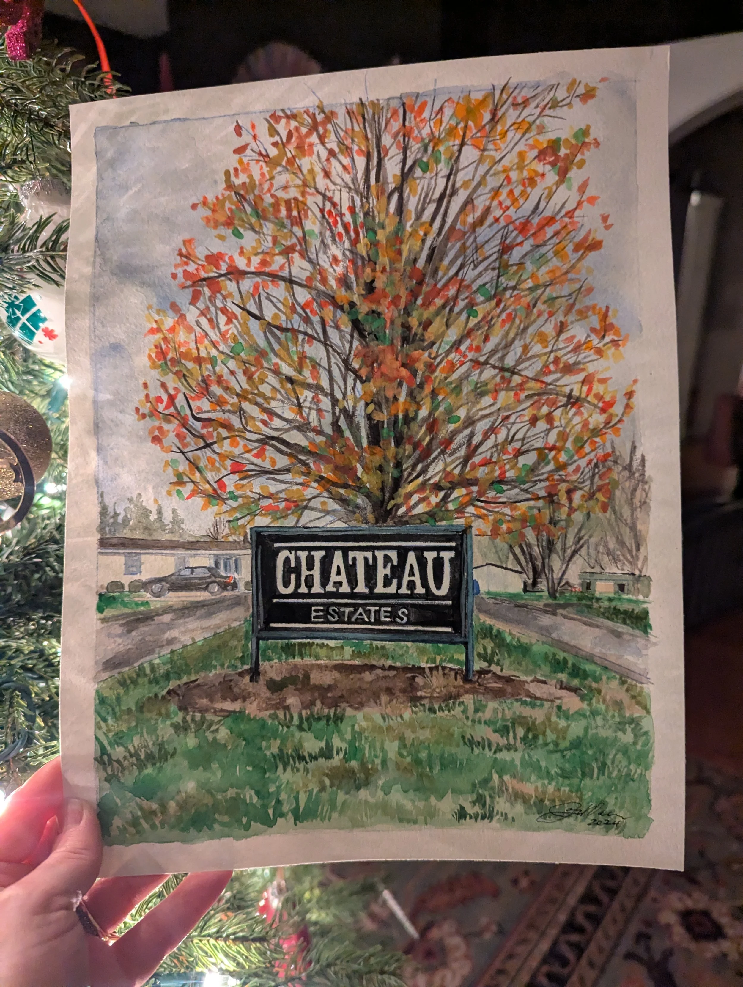 A watercolor painting of a large tree with orange, red, and yellow leaves in front of a sign that reads "Chateau Estates."