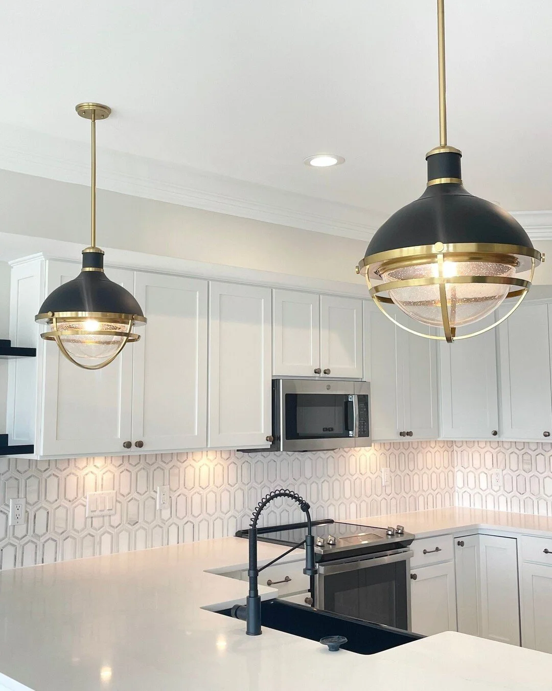 Obsessed with all of the details on this recently finished West OC kitchen ✨ What's your favorite detail? The pendents, the tile, the quartz countertops? Let us know in the comments below! 

Learn more about our custom home build and major renovation