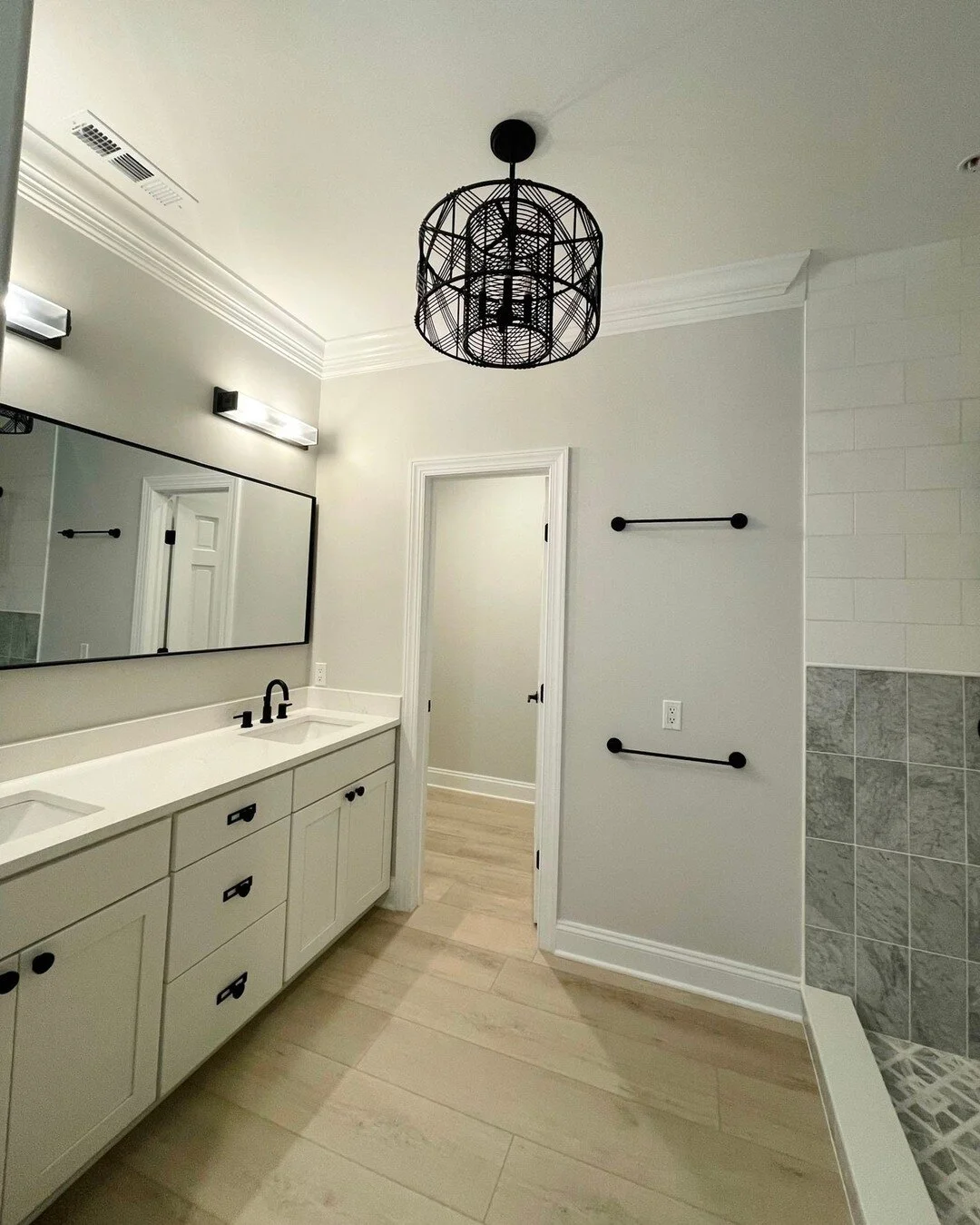 Can't go wrong with classic black and white ✨ We loved bringing this West Ocean City townhouse to life 🌊 Learn more about our custom home build and major renovation services via the link in profile!