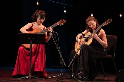  Ana Vidovic and Xuefei Yang, performing for “Virtuosas of Classical Guitar”, an event hosted by James Hunley and his guitar studio. 