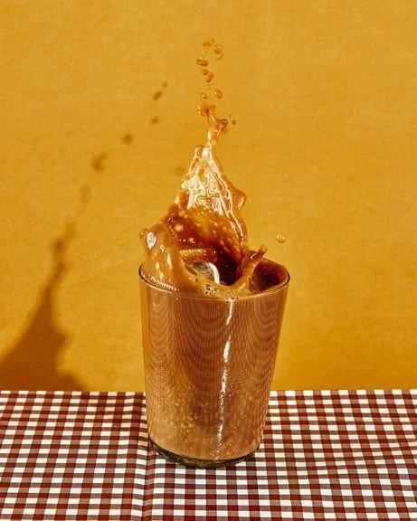 Iced coffee splash collage graphic — specialty coffee Tofino BC
