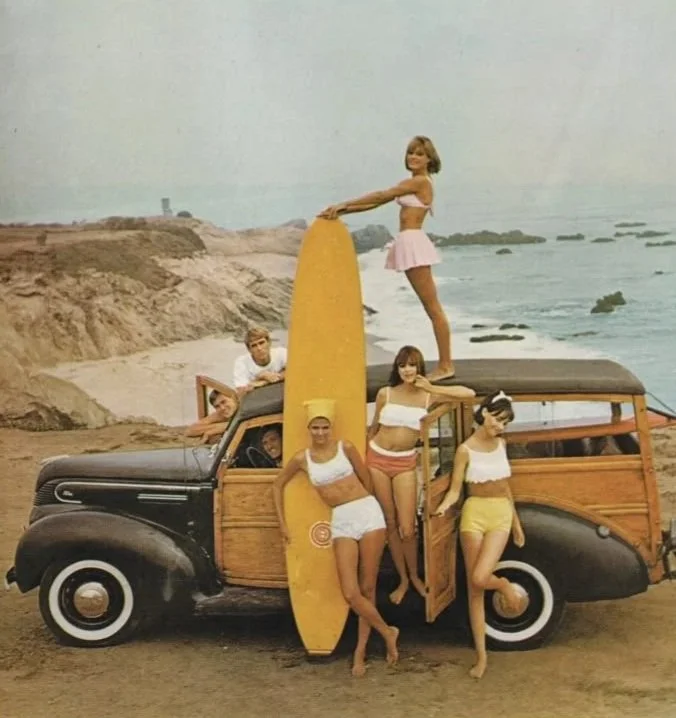 Vintage photo of friends surfing together on a beach — community grocery store Tofino BC