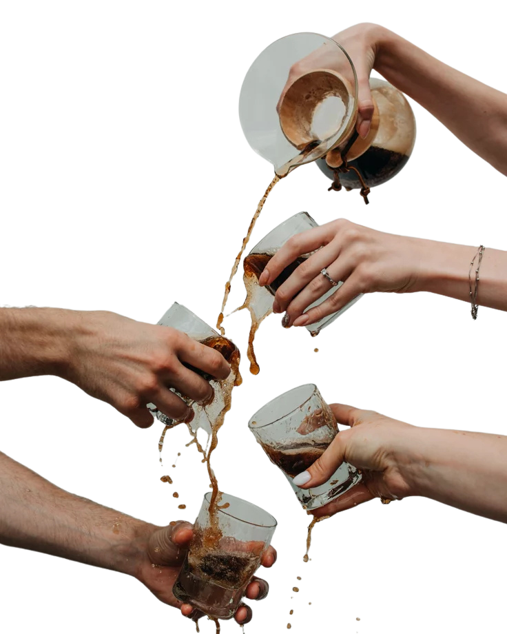 Hands pouring coffee together — community café Tofino BC