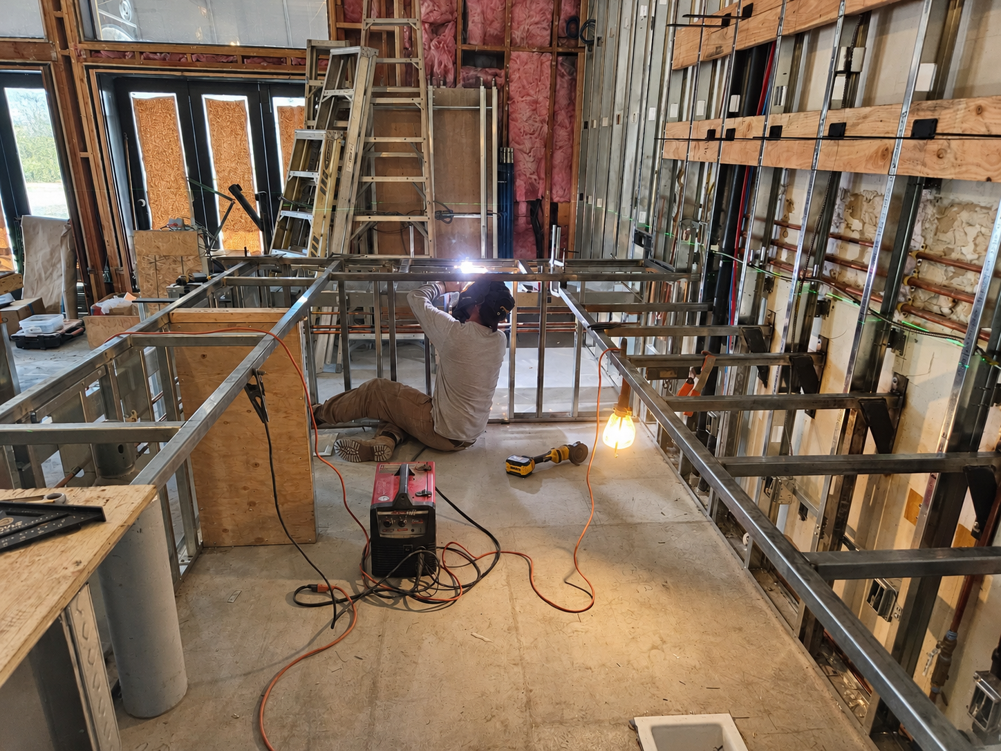 Welder Framing an Unfinished Interior.png