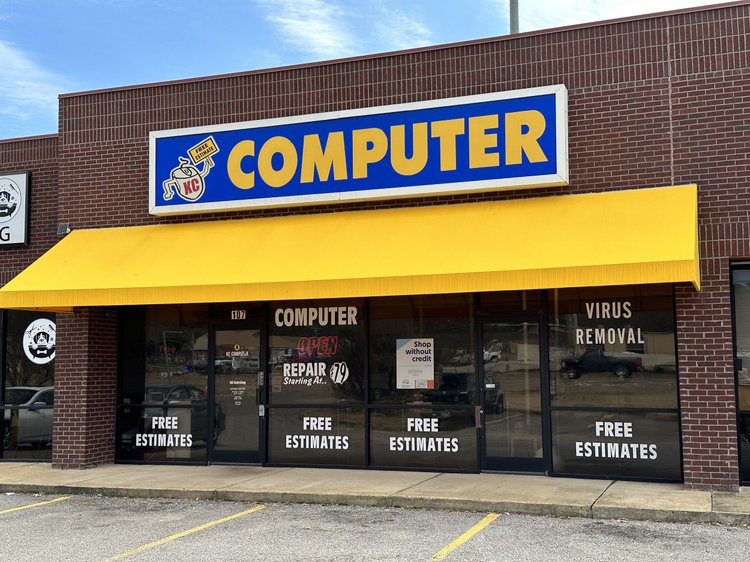 KC Computer store on Summer Avenue in Bartlett, with the yellow awning and free estimates signs in the windows