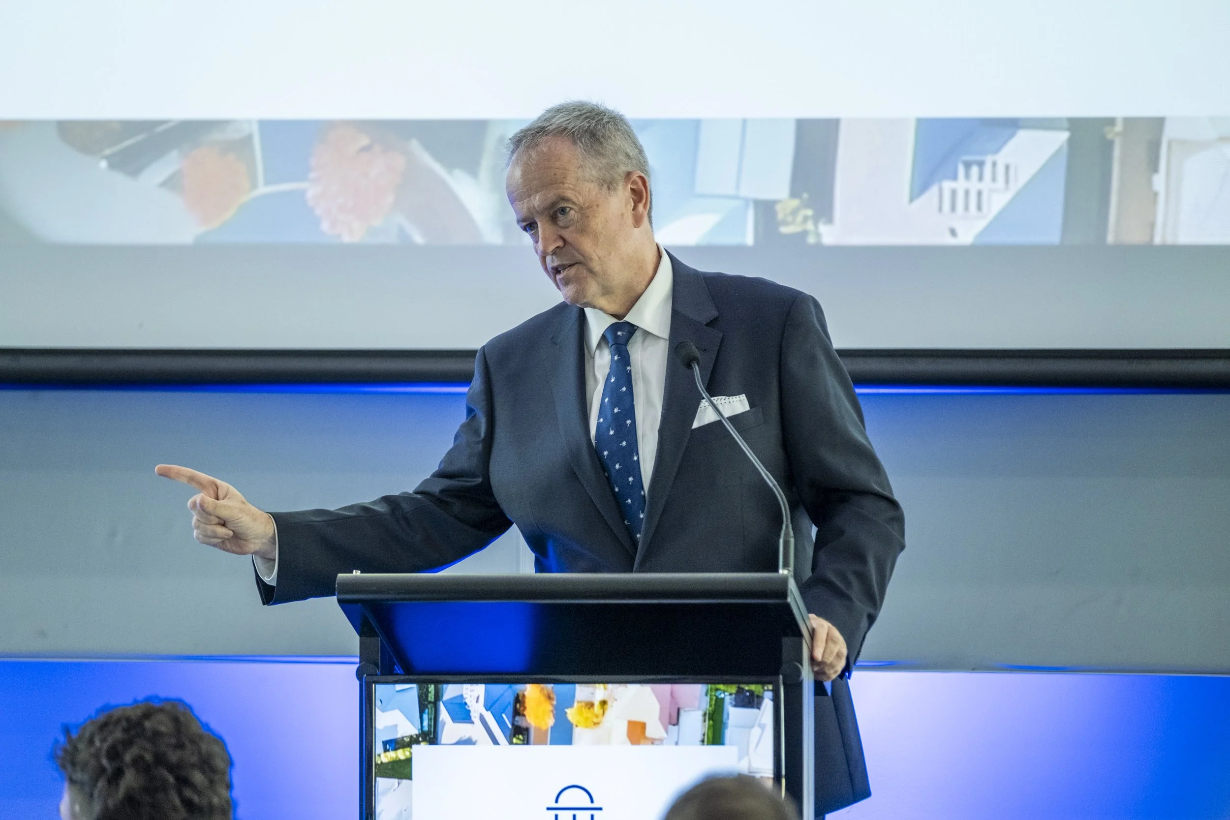 Bill Shorten addressing crowd at housing summit in Canberra, pointed and serious