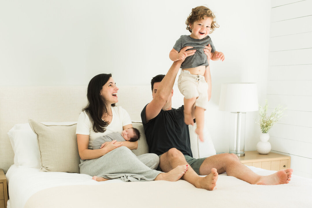 In-home sessions can be so much fun! Sure it's great to get that photo of the whole family smiling and looking straight at the camera but do you know what else is amazing?? Getting those candid shots of everyone laughing! In-home sessions are a time 