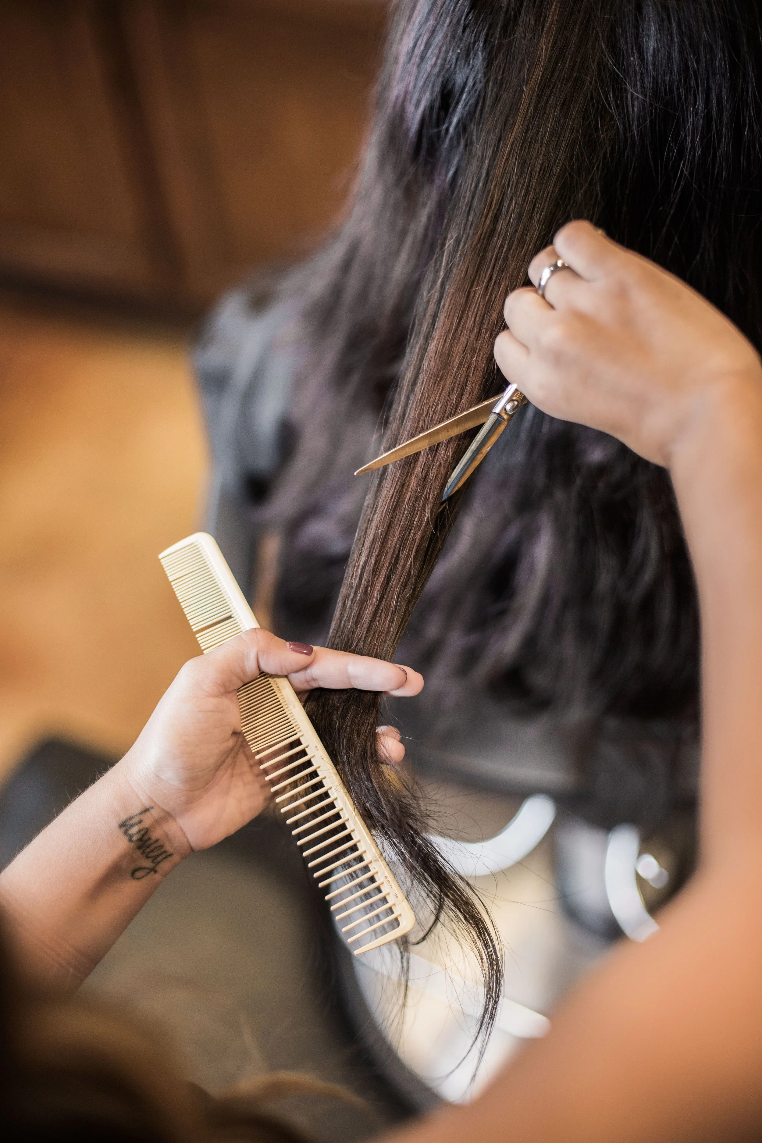 Close-up of hairstylist hands and props captured during a branding session