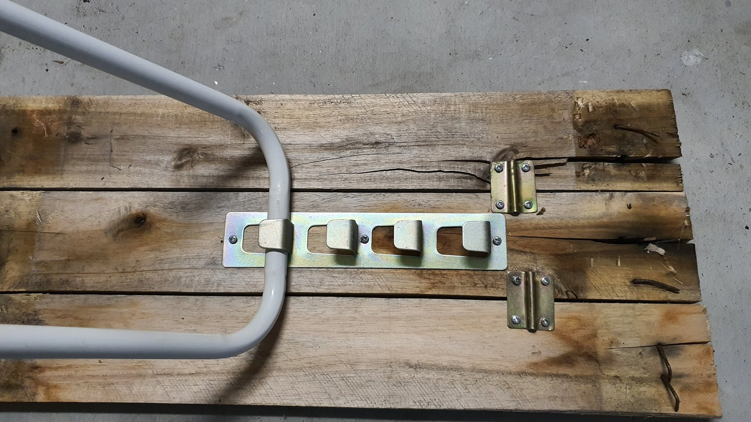 Adjustment plate and saddle clamps from storage hook