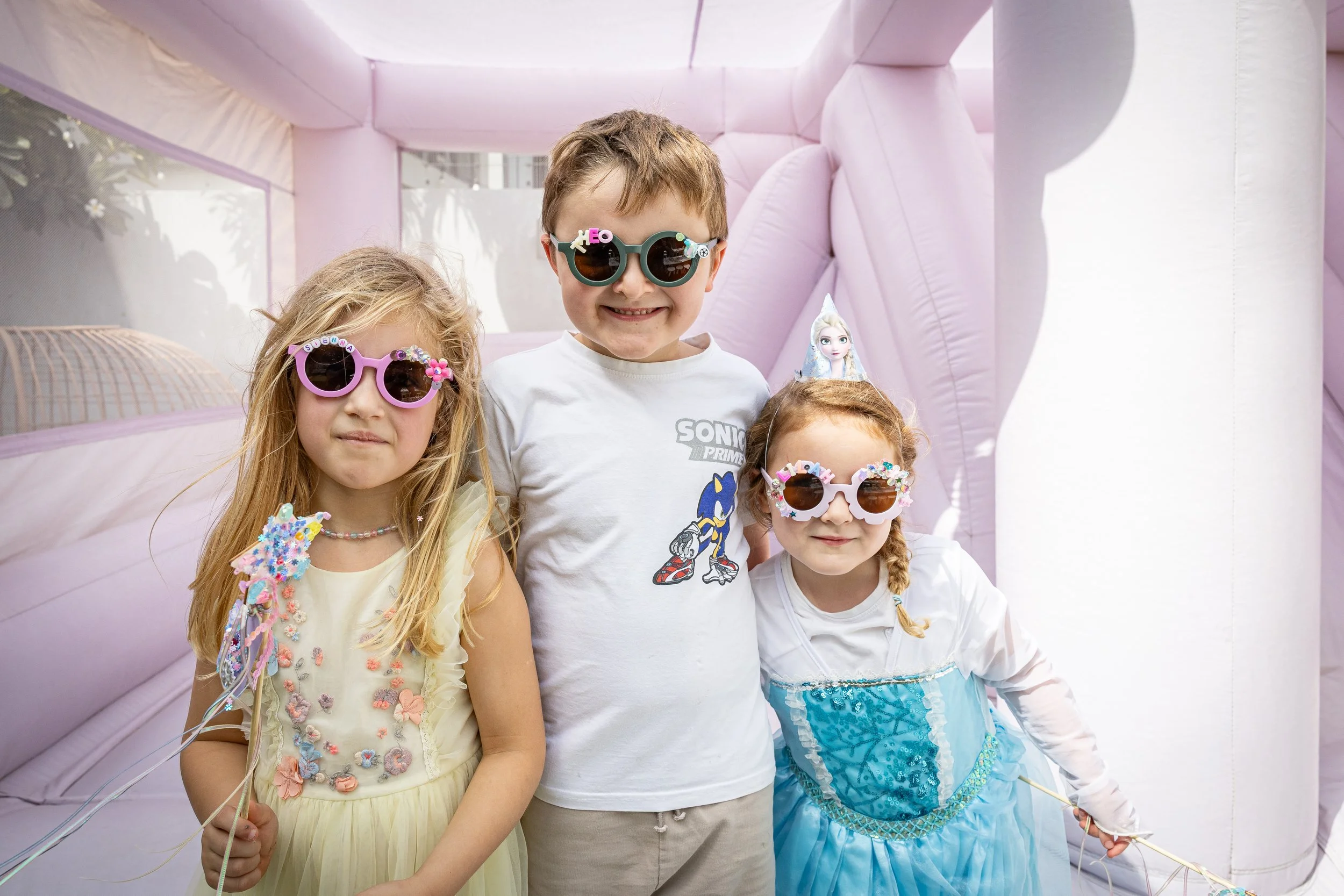 Kids Posing on Bouncy Castle at a Birthday Party.jpg