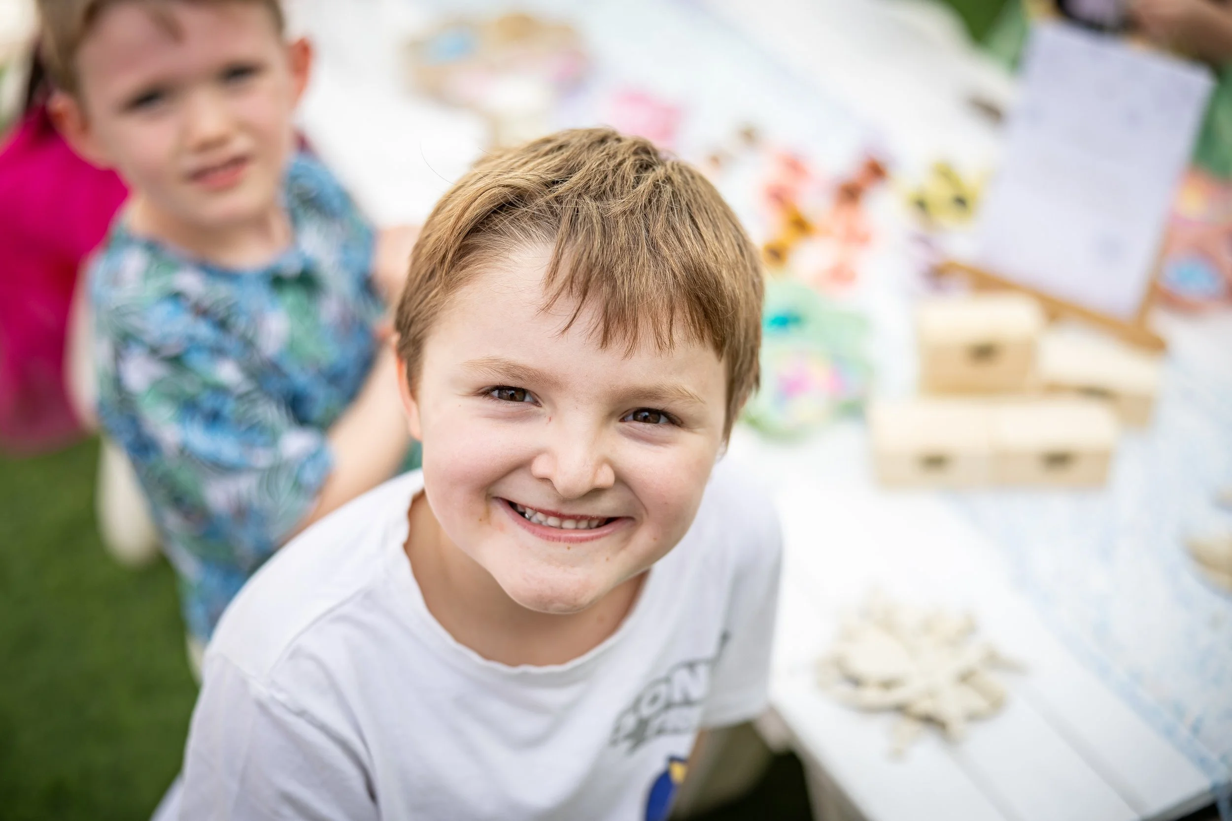 Boy Posing at Craft Table at a Birthday Party.jpg