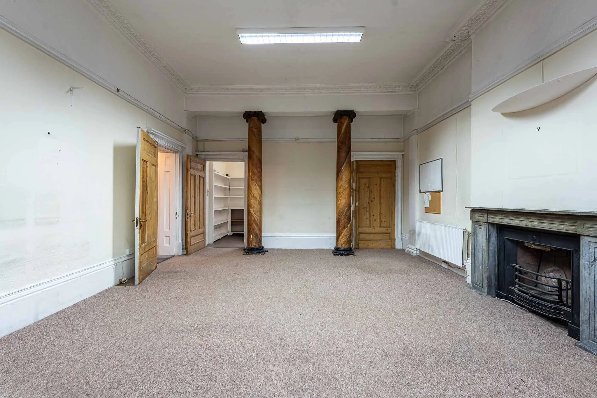 stoke-newington-room-timber-columns-fireplac.jpg