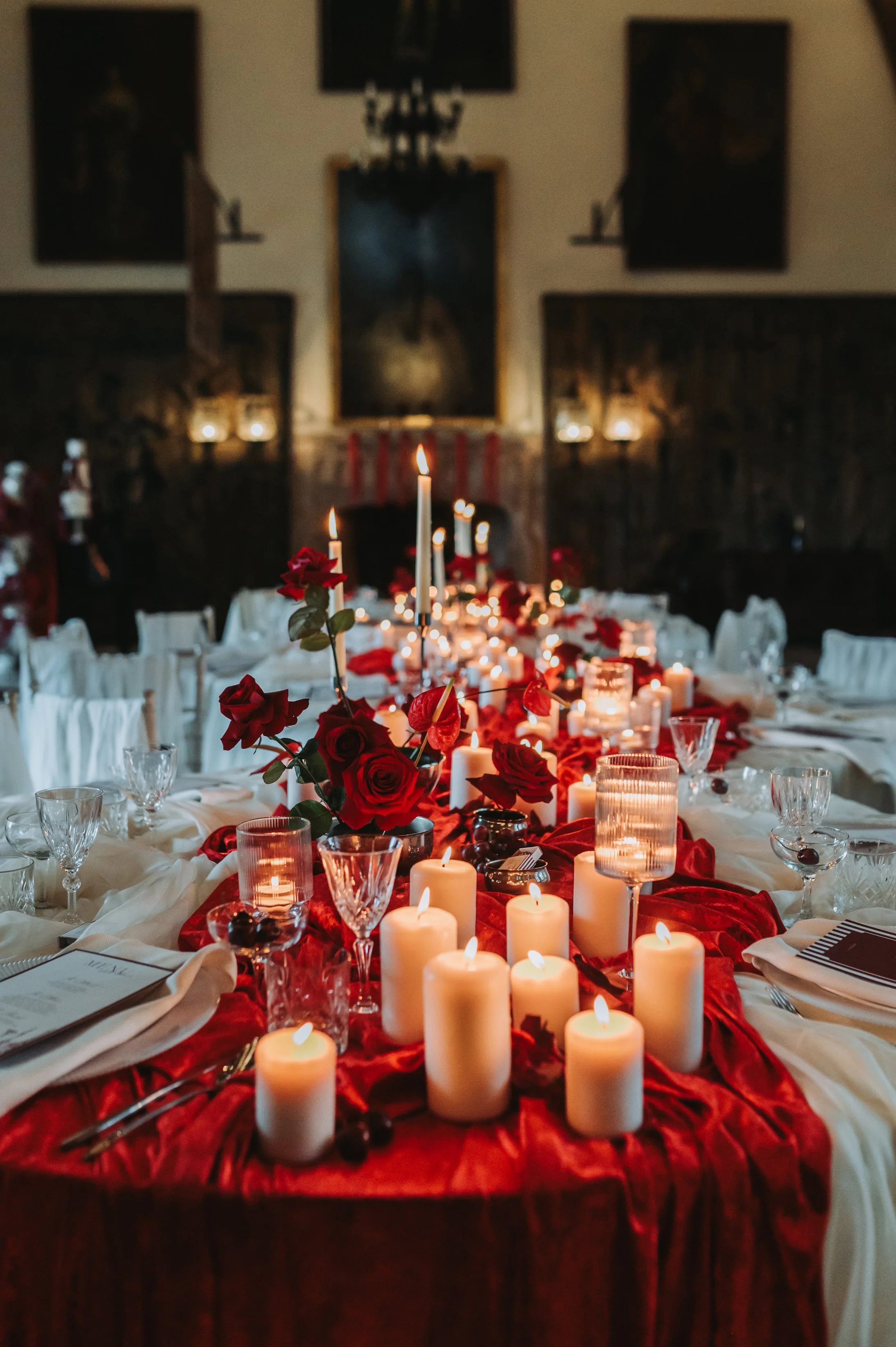 Candles on red table cloth, wedding decor, at Berkeley castle