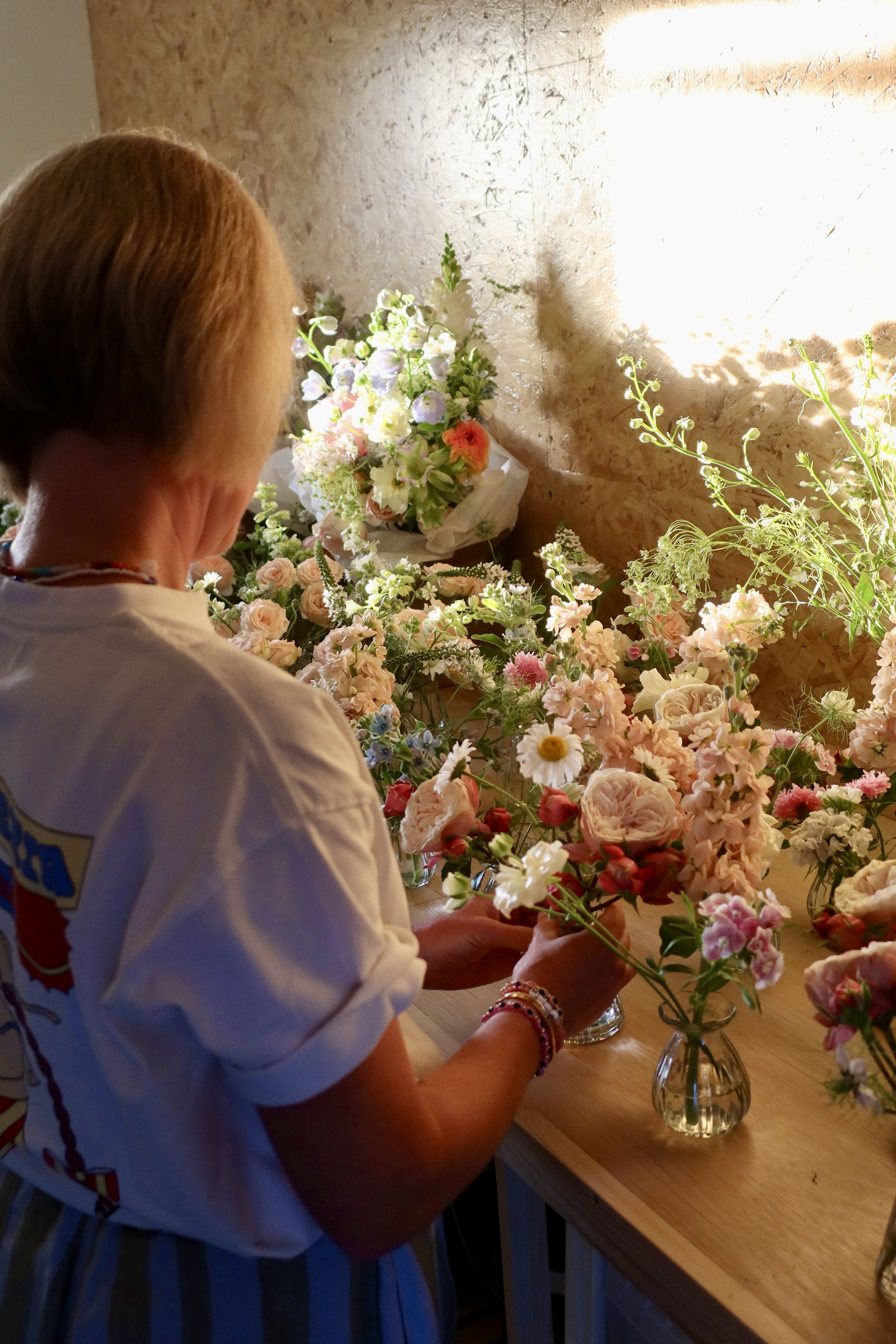 Chloe - founder of Grown Studio Somerset - working on floral arrangements in her home studio in Somerset.