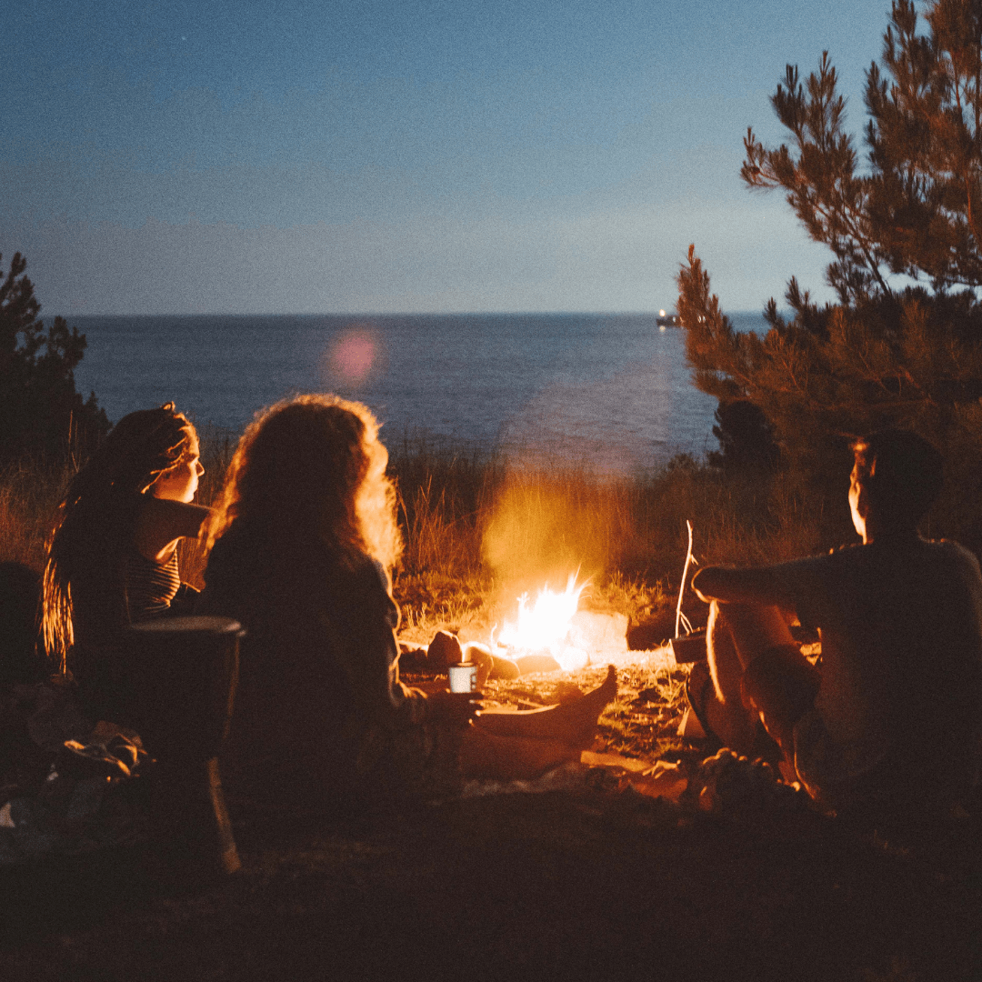 Image of friends at a camp fire representing attachment therapy