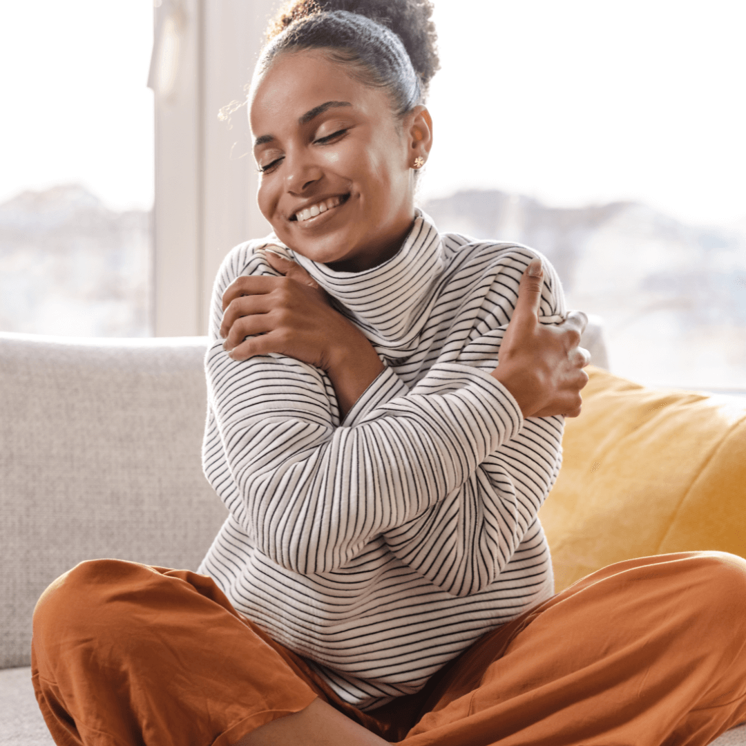 A girl smiling and reflecting while dealing with self-doubt, illustrating strategies shared by a trauma therapist in Eola Heights, Orlando.