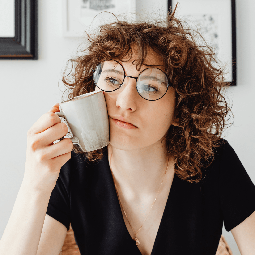 Image of a girl feel stressed with her coffee image represents EMDR Therapy