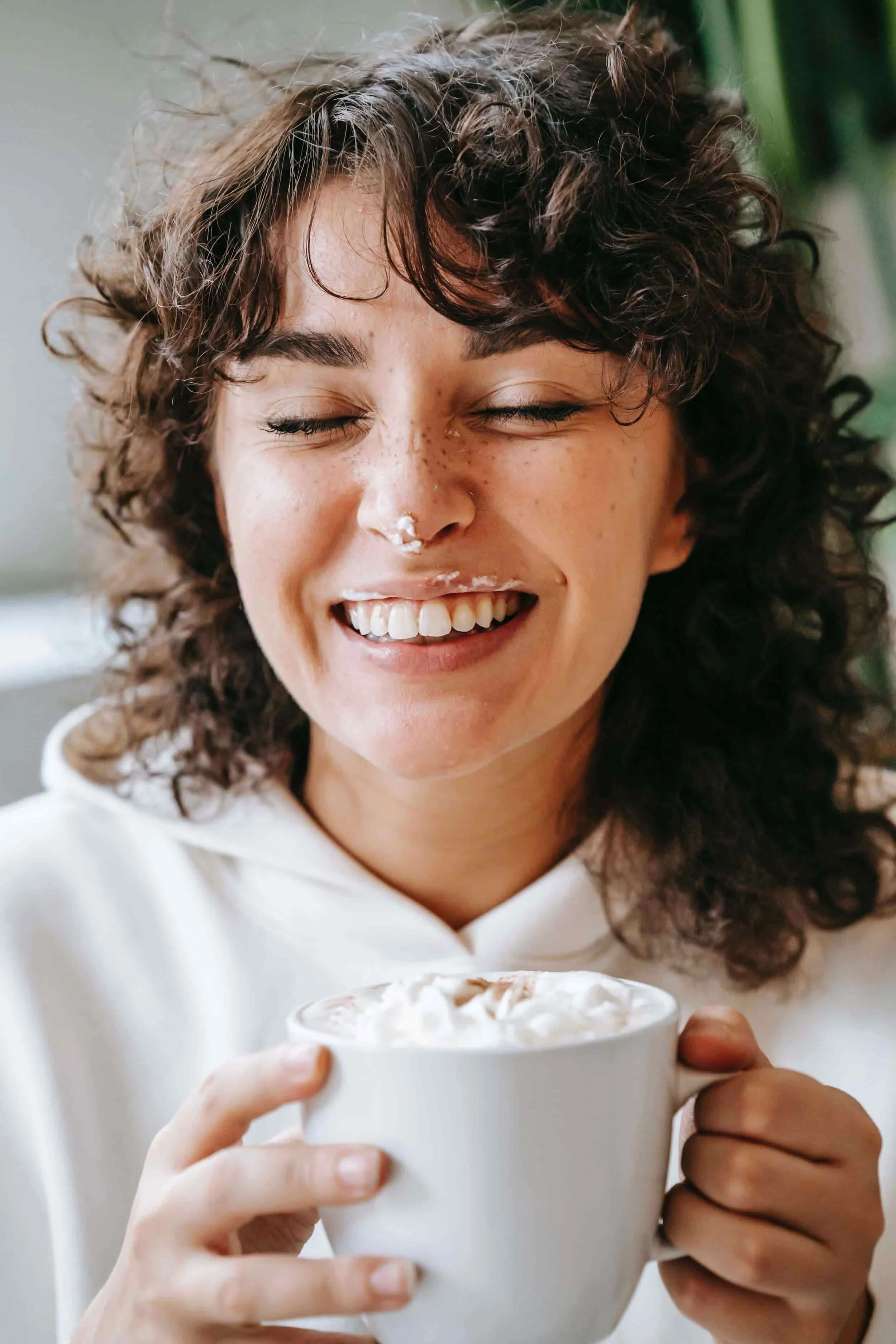 Lady drinking coffee on couch showing how therapy Orlando can help. Our therapists provide therapy for anxiety, trauma, depression, for adults and teens in Orlando.