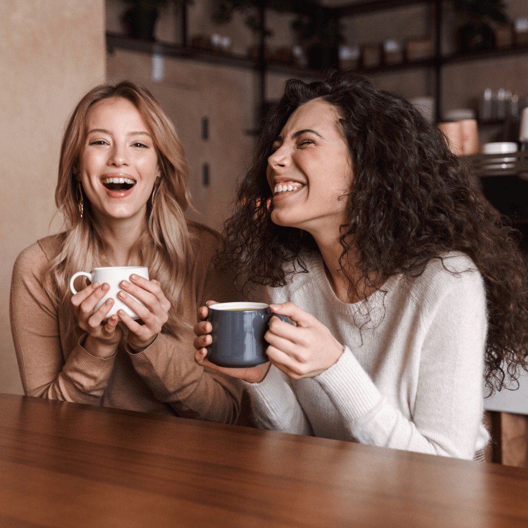Image of two friends chatting over coffee representing attachment therapy