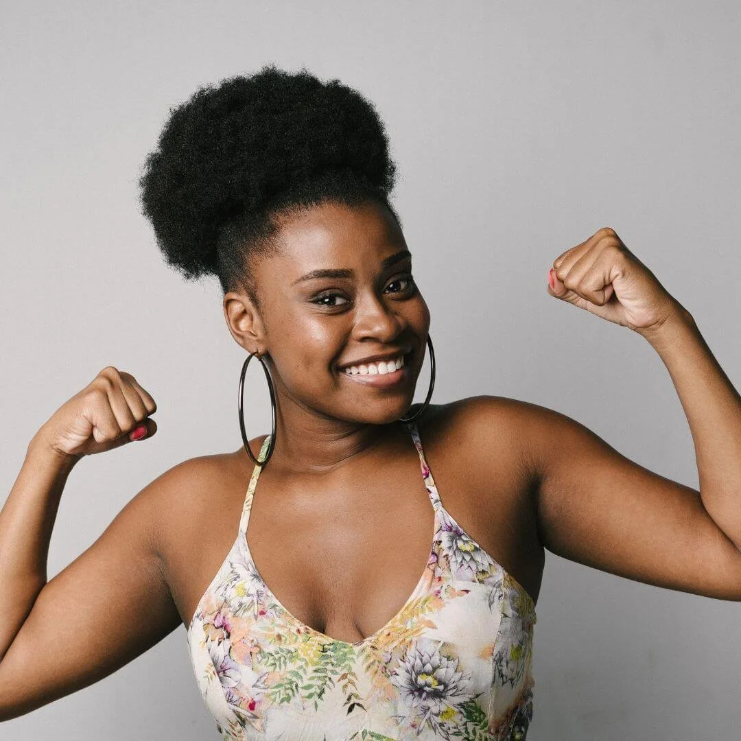 Image of a girl showing her arms and how brave she is representing Orlando Therapist guiding you in choosing the word of the year.