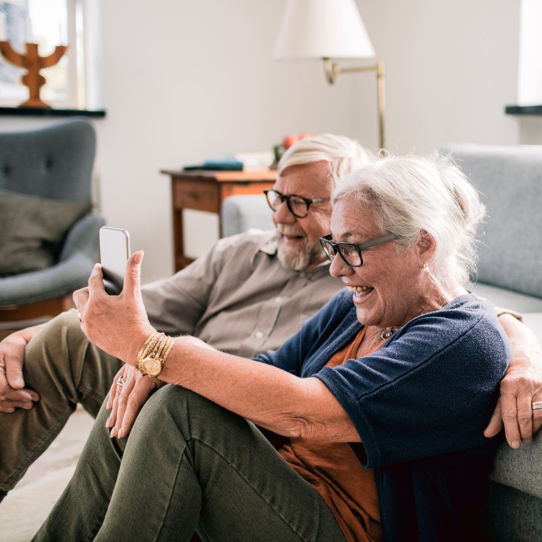image of a couple looking at a phone representing avoidant attachment