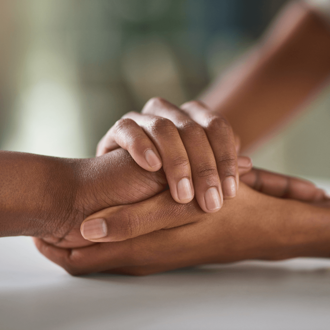 Image of two people holding hands representing anxiety therapy