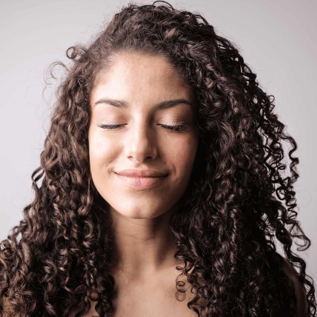 Image of a girl with her eyes closed representing Orlando Therapist guiding you in choosing the word of the year.