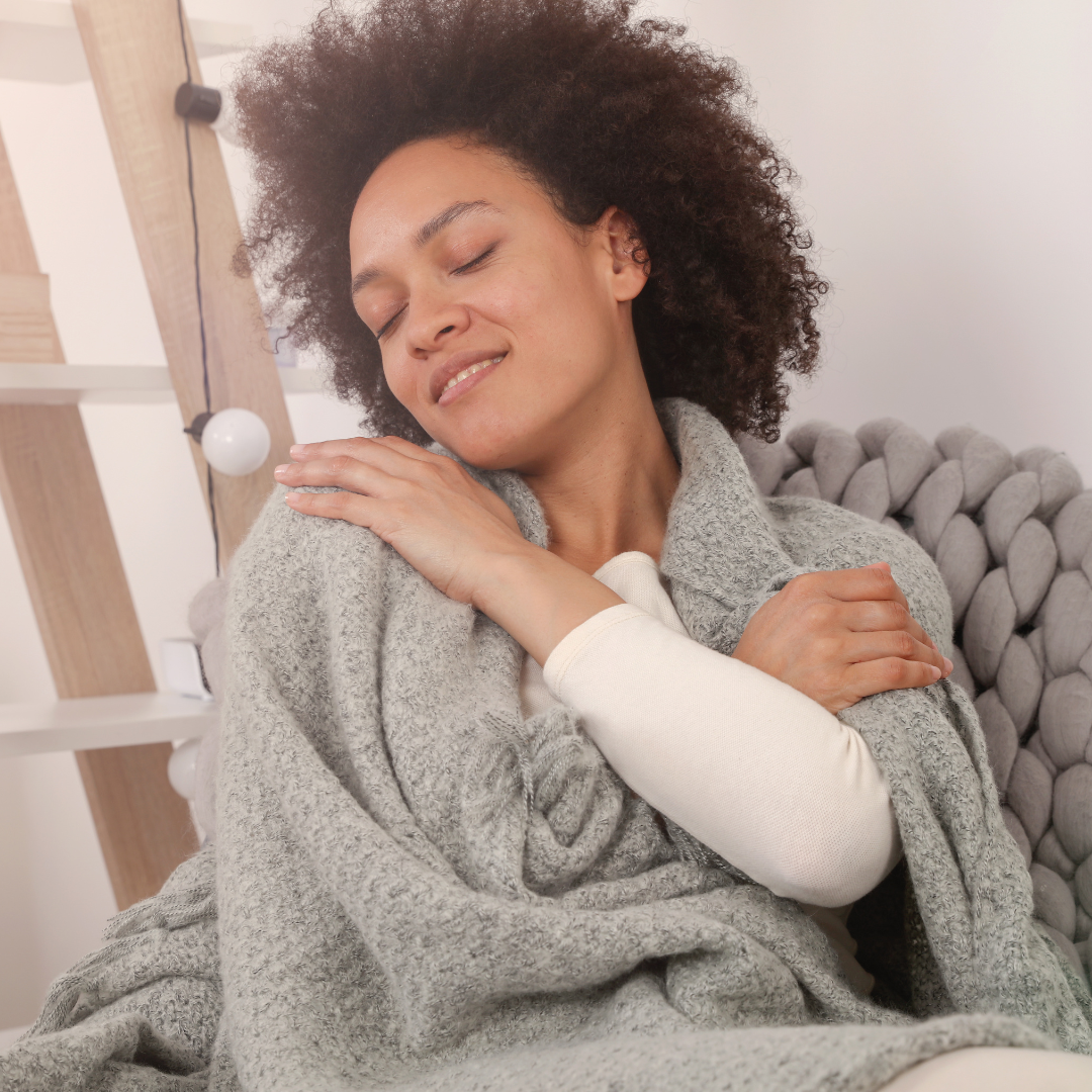 image of a girl hugging herself representing self compassion