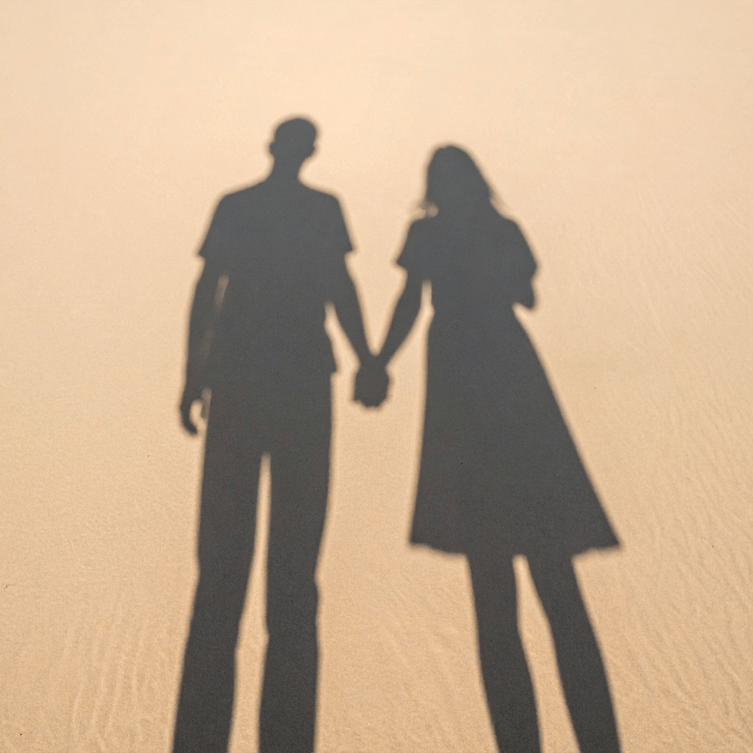Image of a couples shadow in the sand representing Secure Attachment Therapy