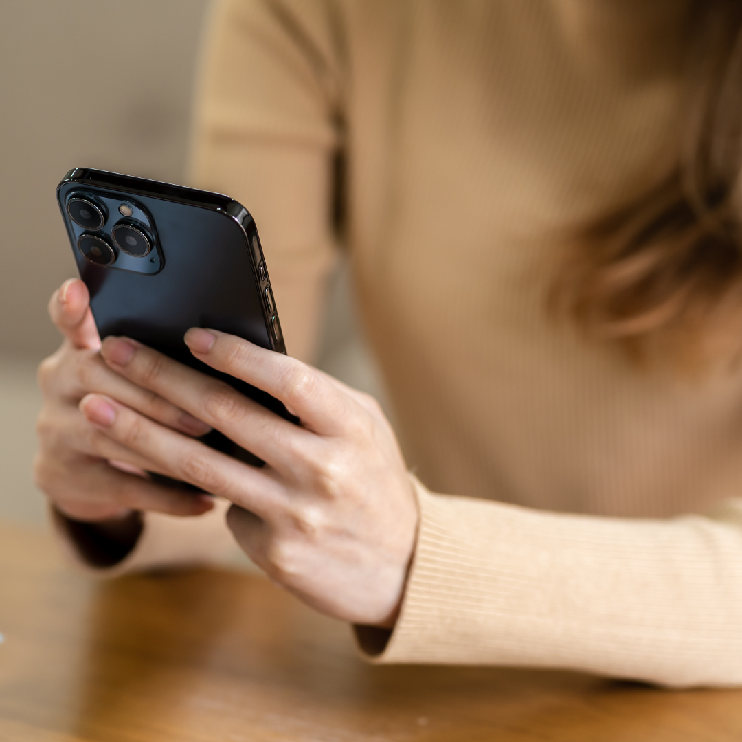 Image of someone using a cellphone representing anxiety therapy