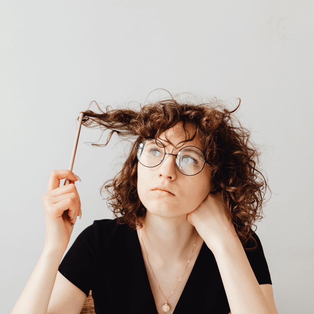 A girl reflecting while dealing with self-doubt, illustrating strategies shared by a trauma therapist in Eola Heights, Orlando.