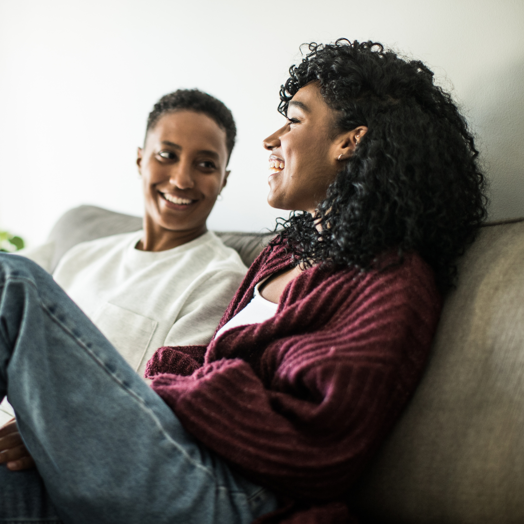 Image of a couple laughing, representing attachment therapy