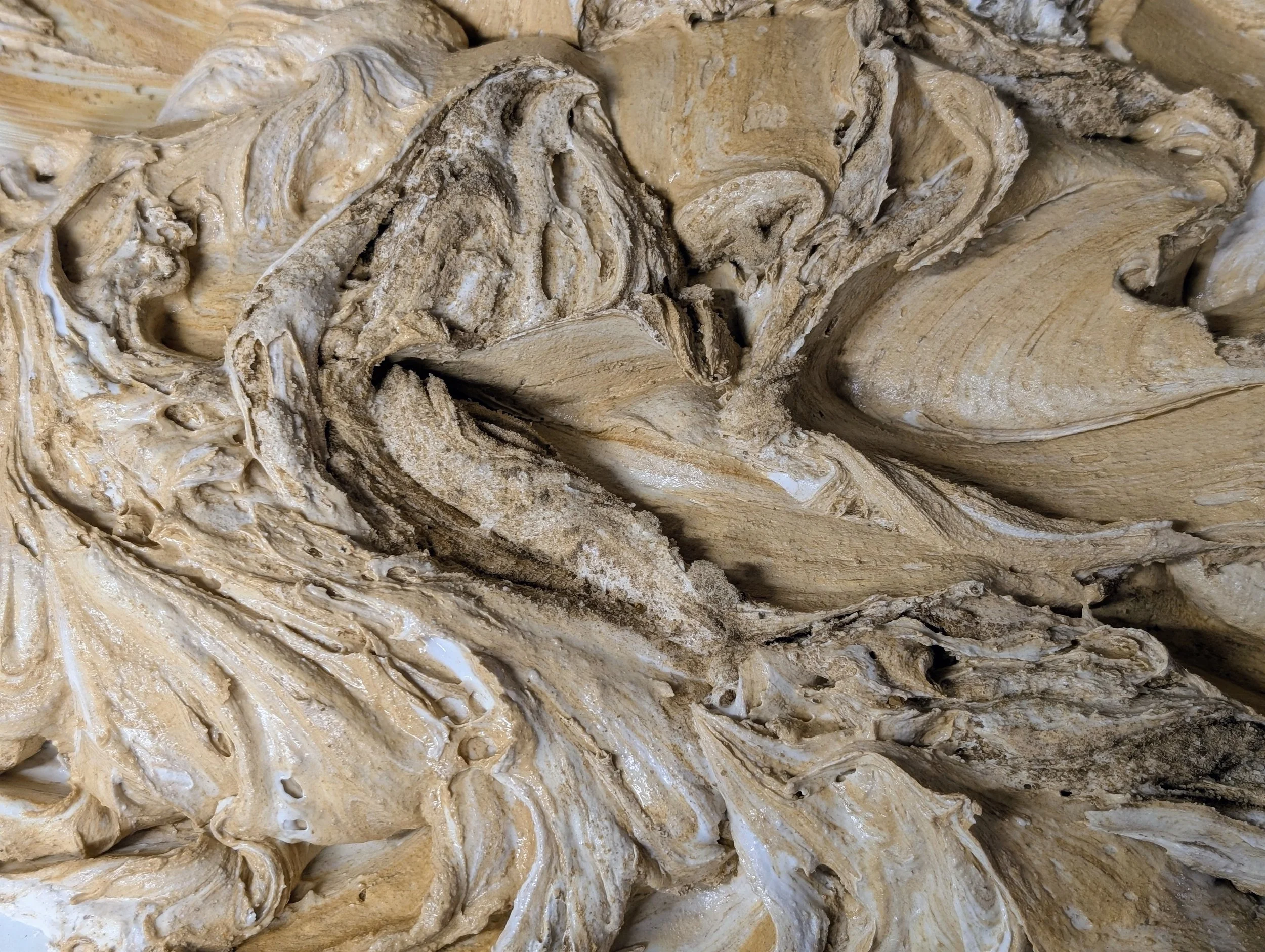 Plaster Preparation (Detail) | Macro view showing unblended striations of joint compound, sand aggregate, and earth pigment