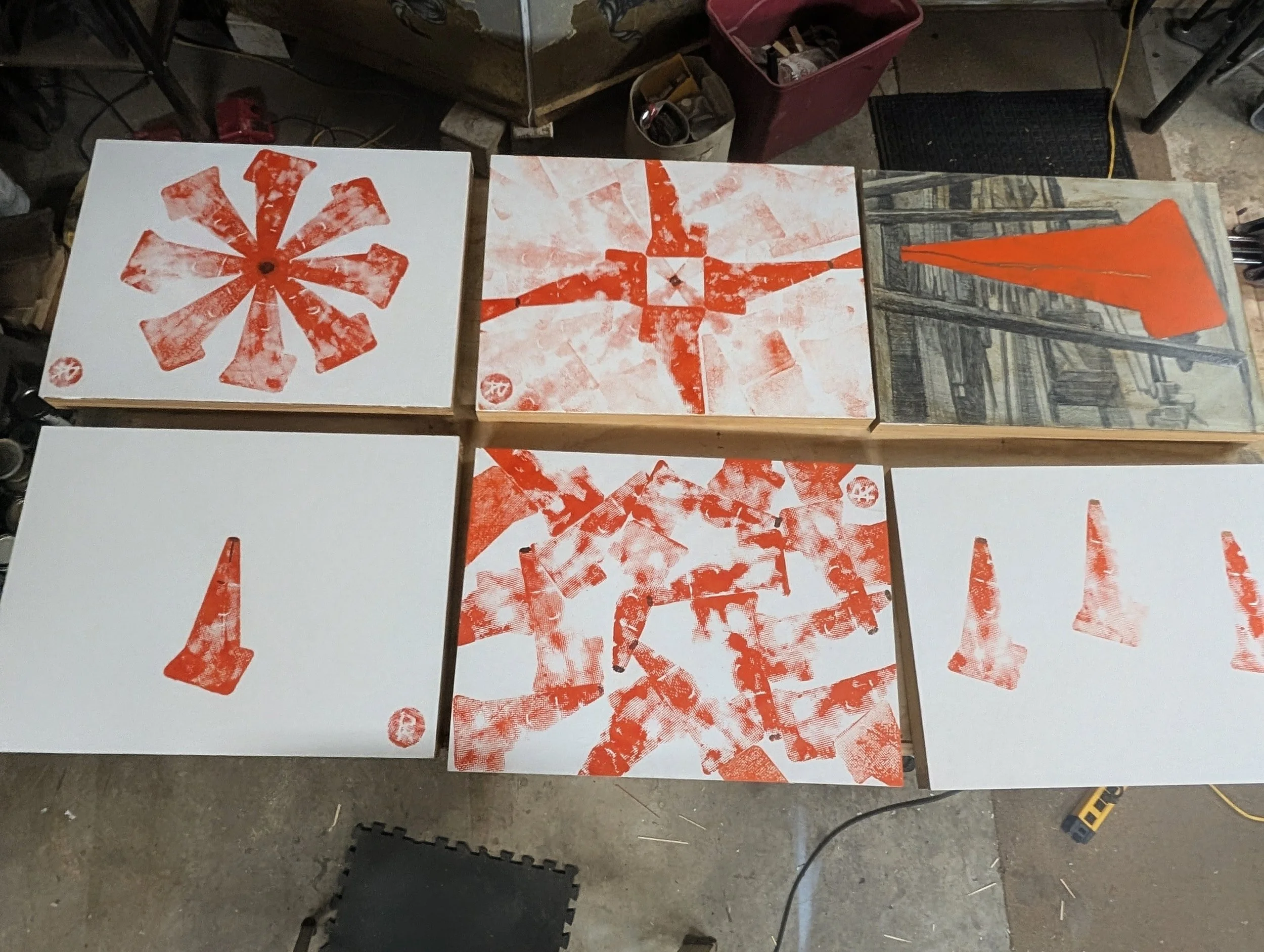 Traffic Cone Print Series | Overhead view of sequential stamping compositions and panel studies.