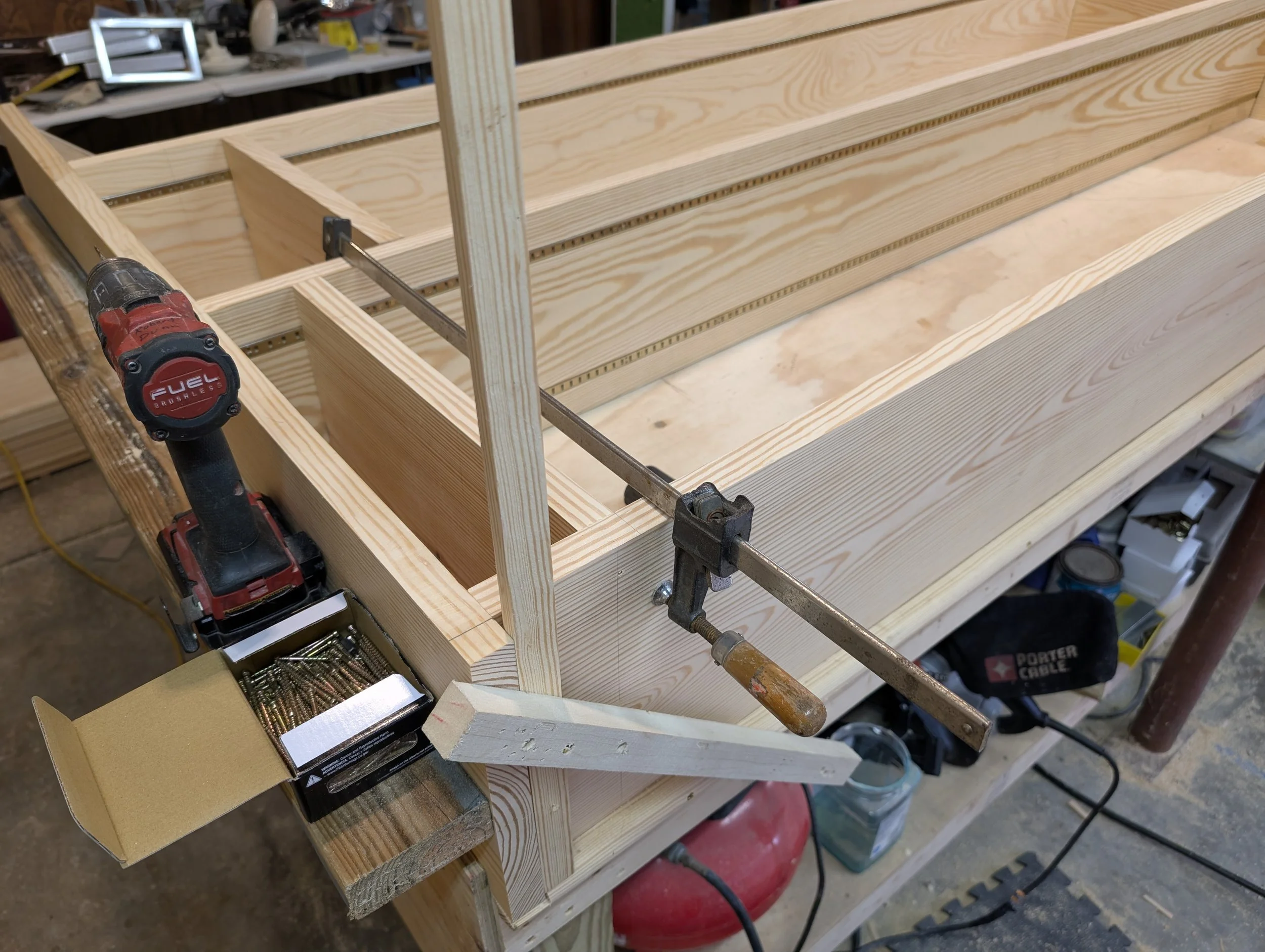 Custom Library Casework (In Progress) | Workbench assembly and framing view of raw pine library unit