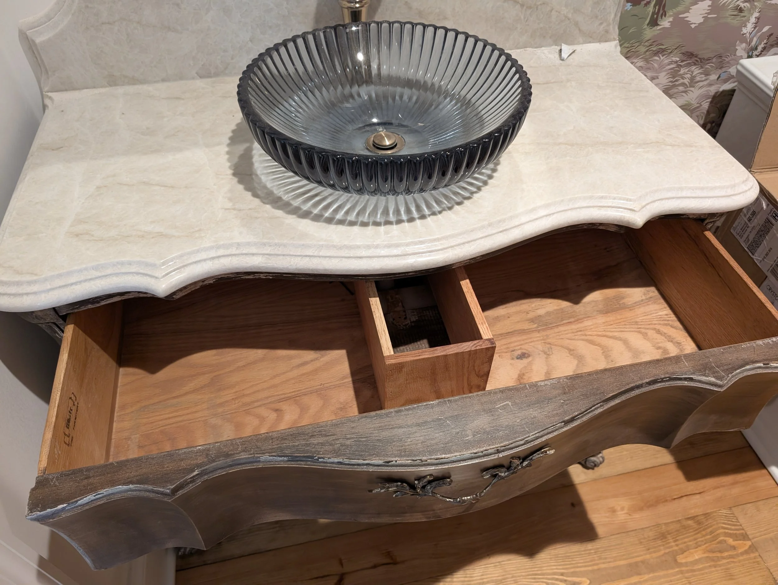 Antique Vanity Conversion (Plumbing Modification) | Custom modification of an antique commode into a vessel-sink vanity, featuring custom U-shaped timber drawer box reconstruction for P-trap and supply line clearance
