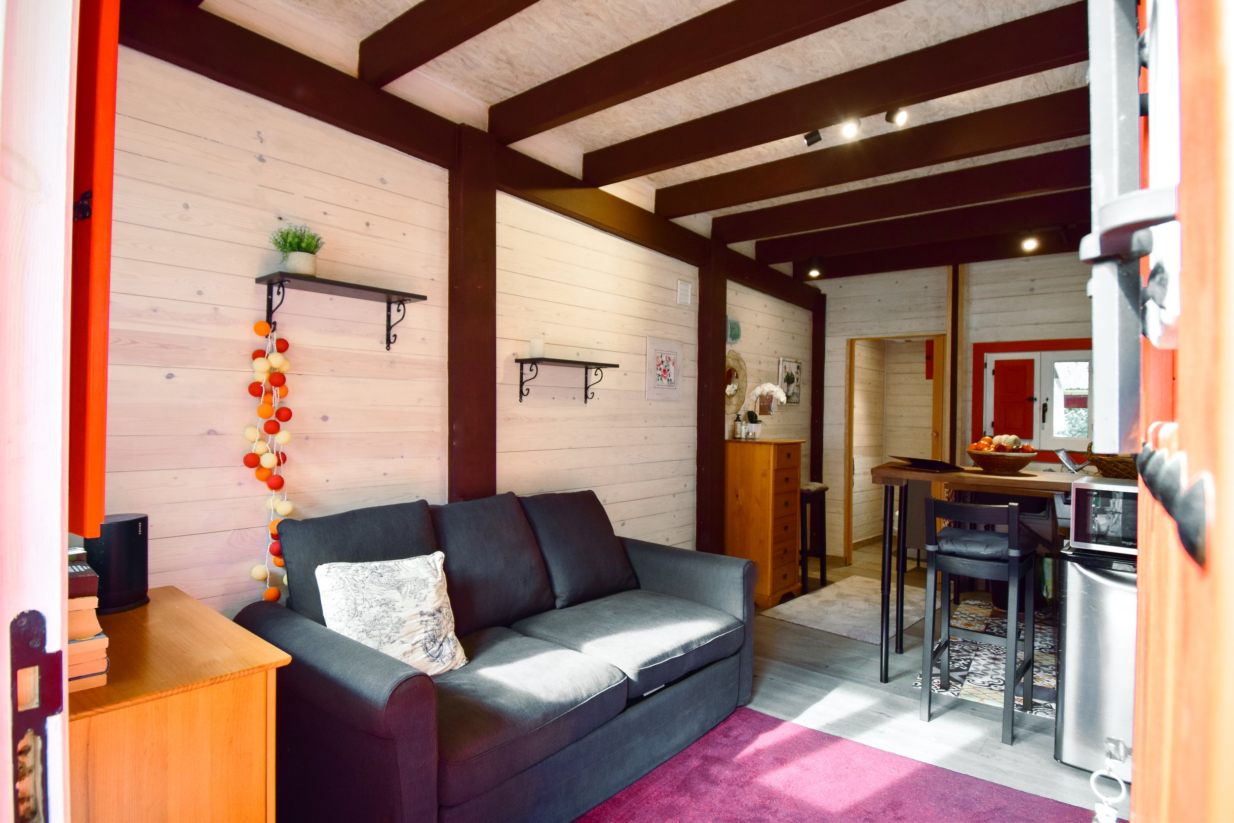 The living room has access to a toilet area