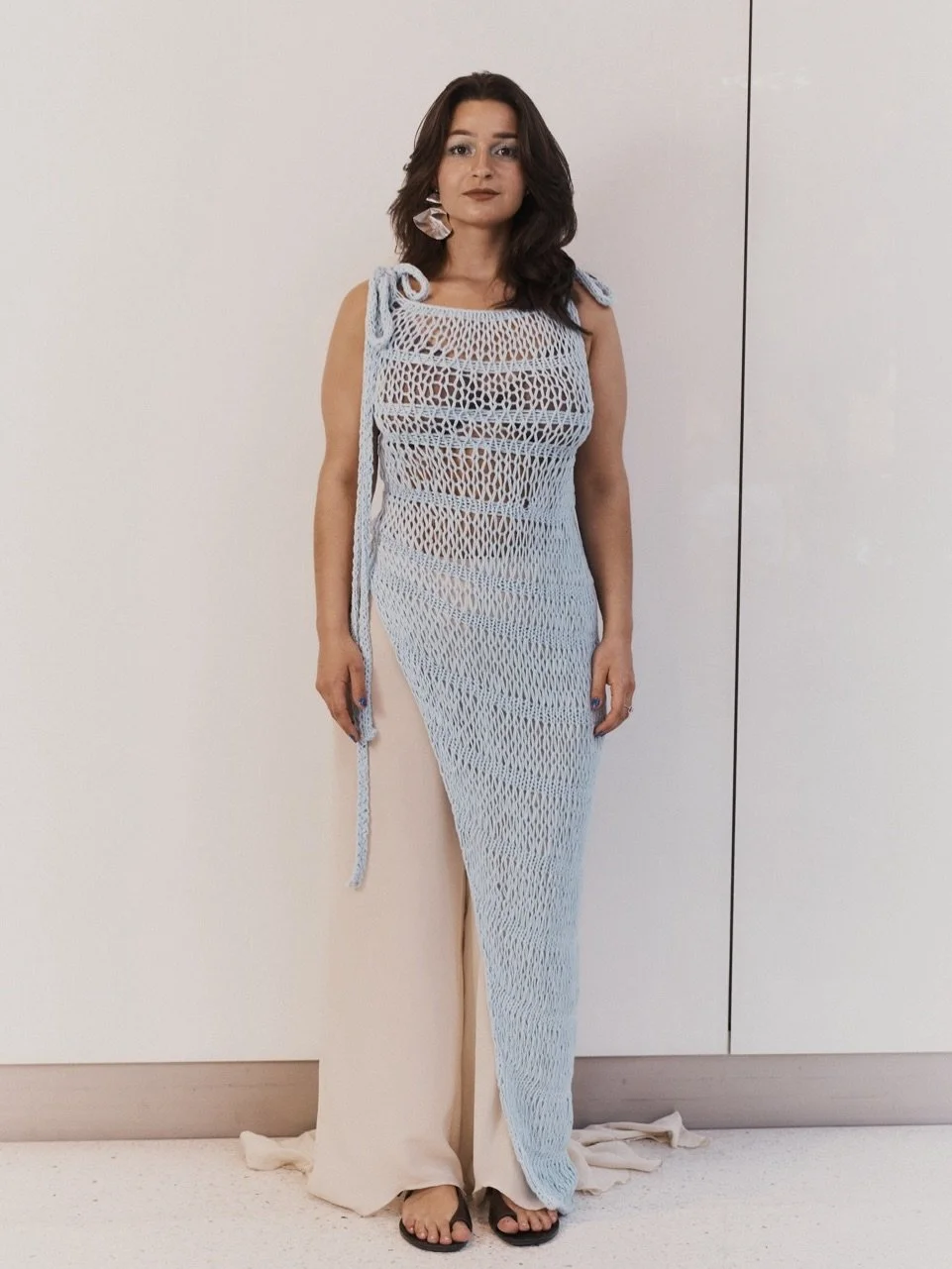 Handknitted asymmetrical dress with flared pants | SS26-STIGMA

Model @merleazz 
Picture @victoriakaempfe 
Jewelry @atelier.ellepe