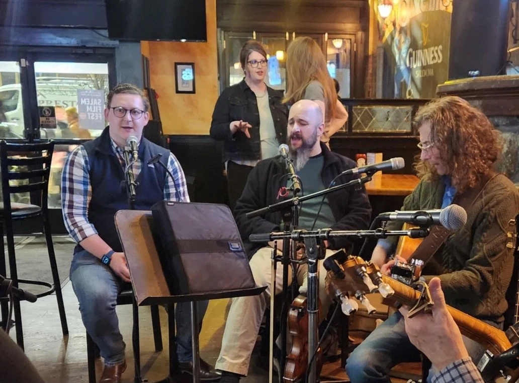John singing in an music session at a pub.