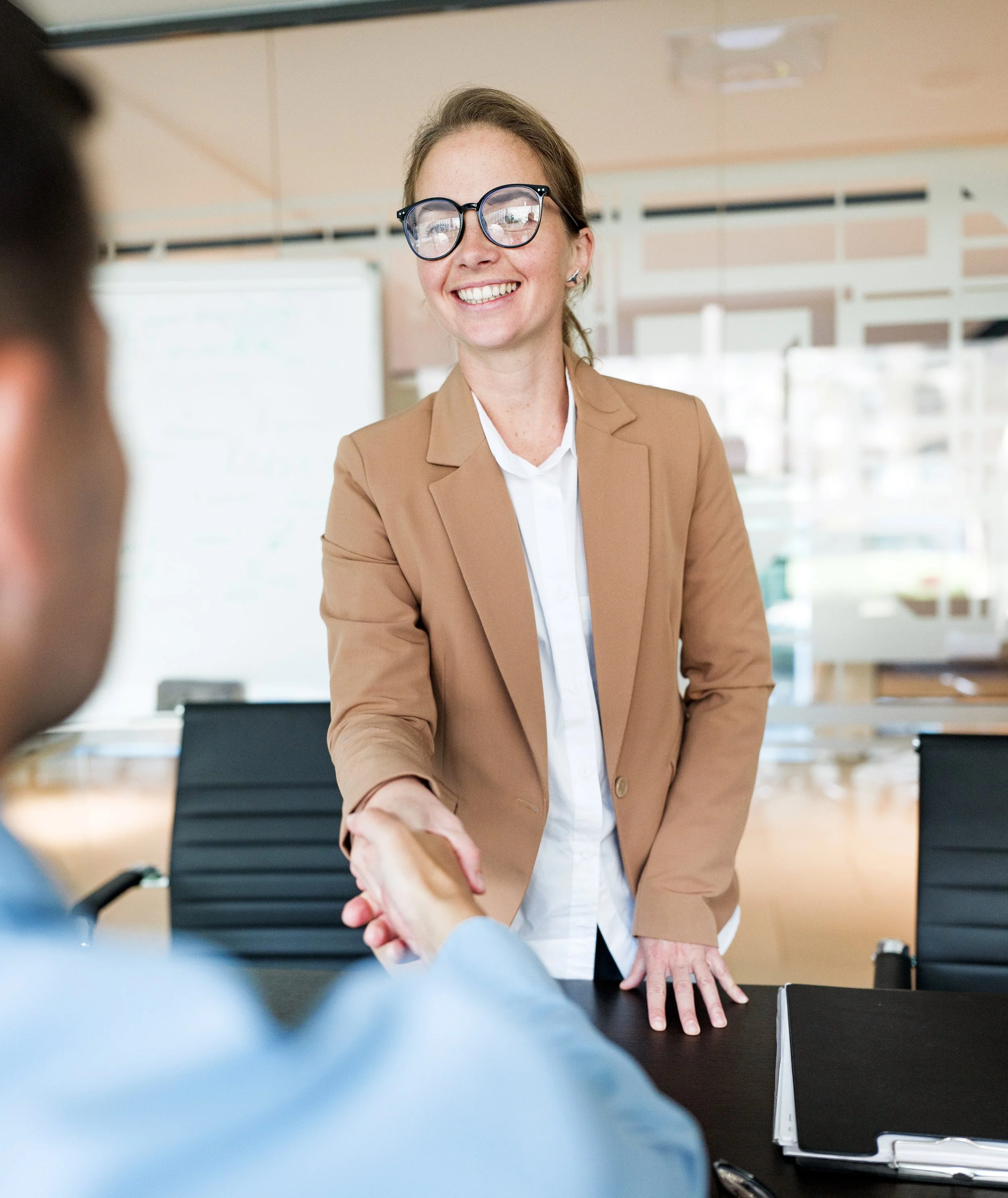 two business professionals agreeing to an approved schedule of consultant's services.