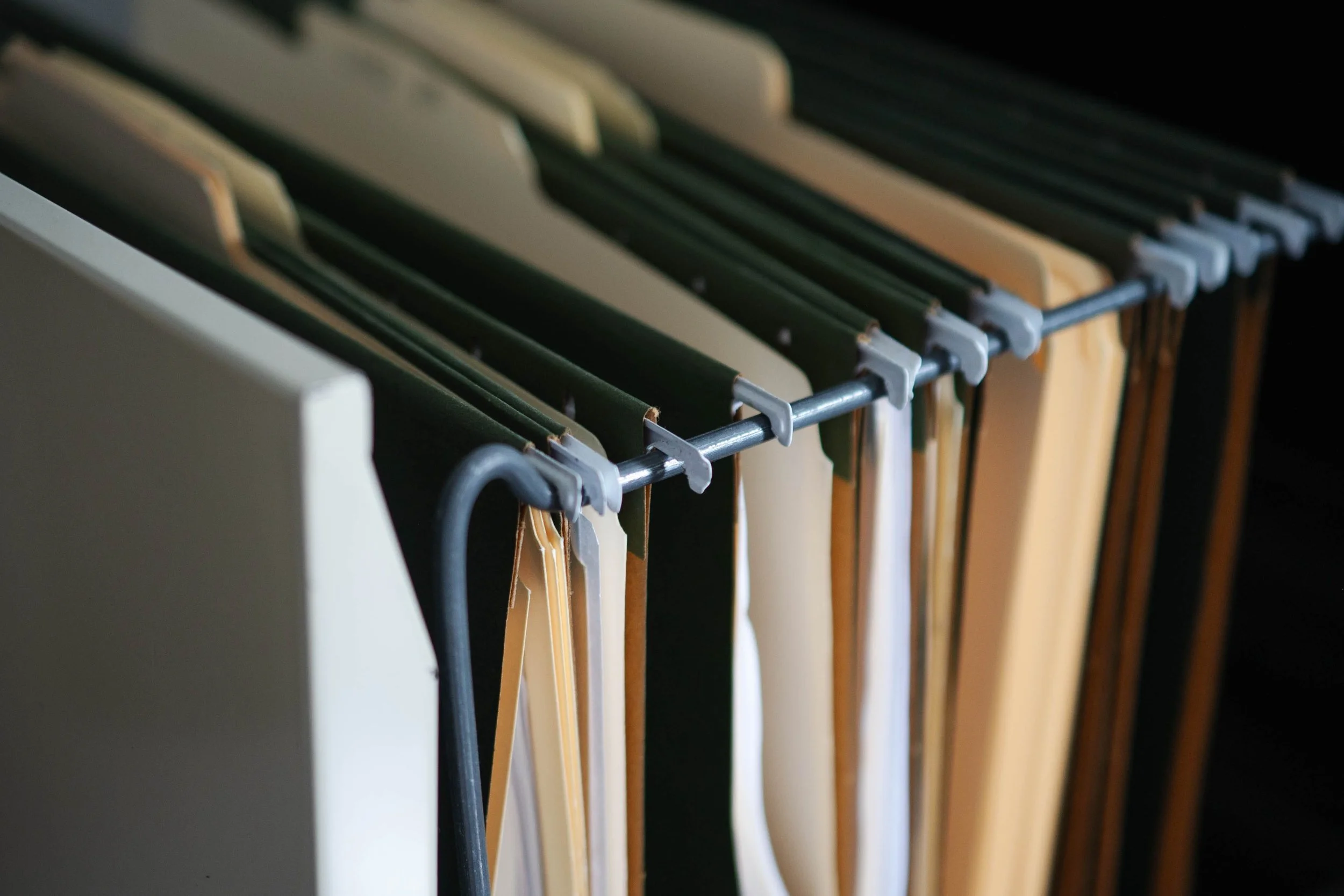 Organized project files and binders on a shelf