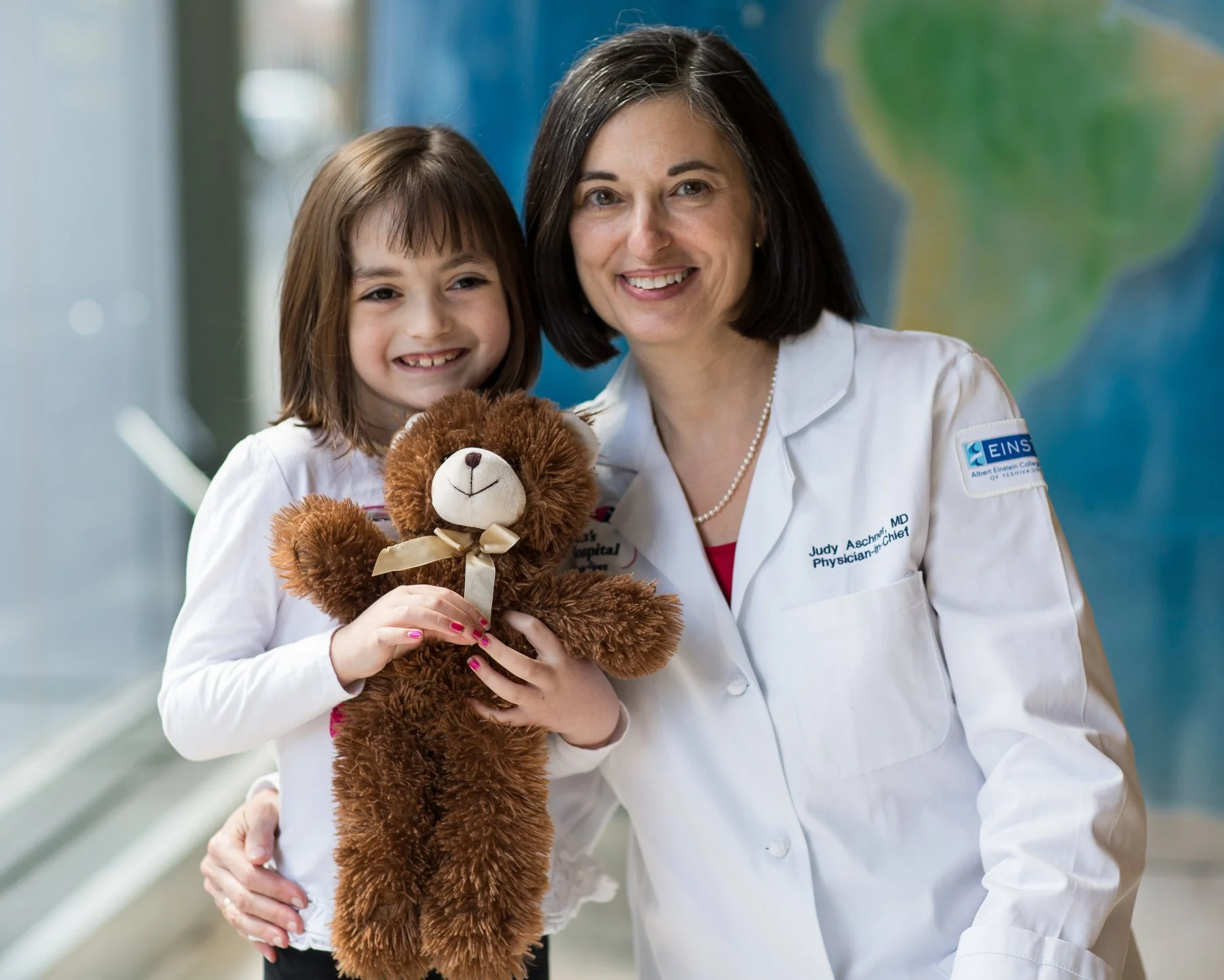 Dr. Aschner and child in CHAM Lobby- 10 x8.jpg