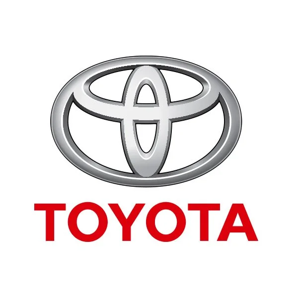 Toyota logo with silver emblem above red text 'TOYOTA'.