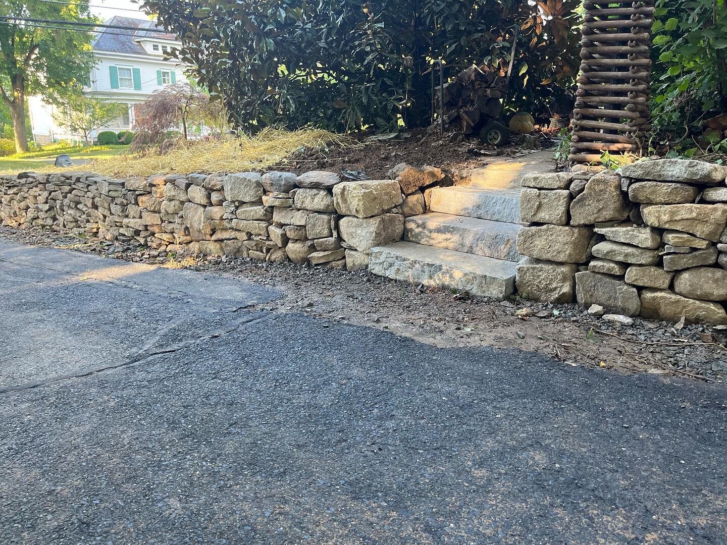 A little natural stone action&hellip; Expanding the usable driveway space by installing (3) natural boulder walls, (2) sets of steps, new drainage (ignore the black pipe- for some reason it&rsquo;s laying there but not in use) #hardscapenj #boulderbo