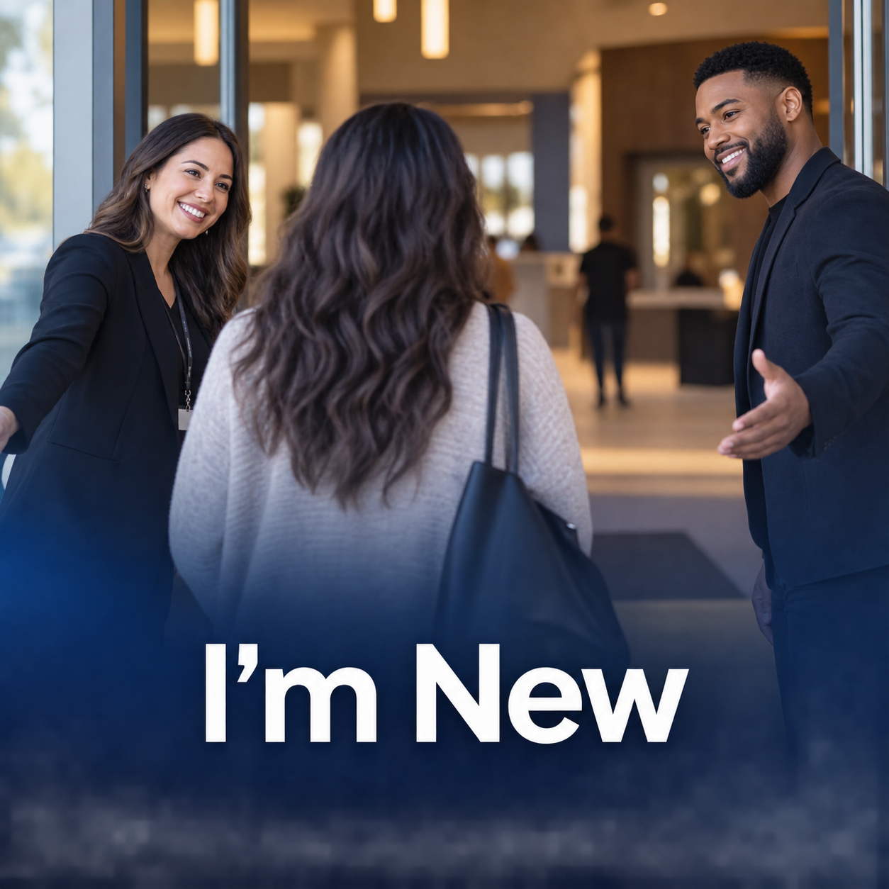 A woman with long dark hair talking to a smiling man and woman, welcoming her at the entrance of a modern building. The text on the image says, "I'm New."